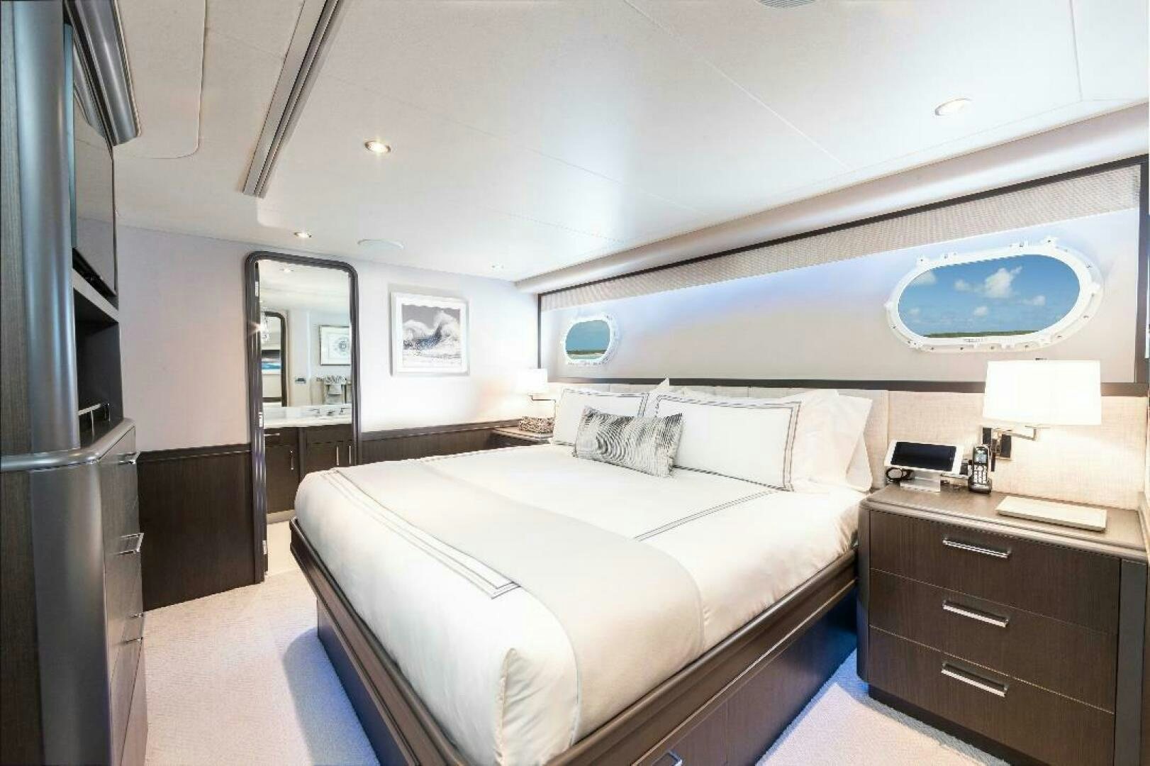 a bedroom with a large bed aboard MEMENTO VIVERE Yacht for Sale