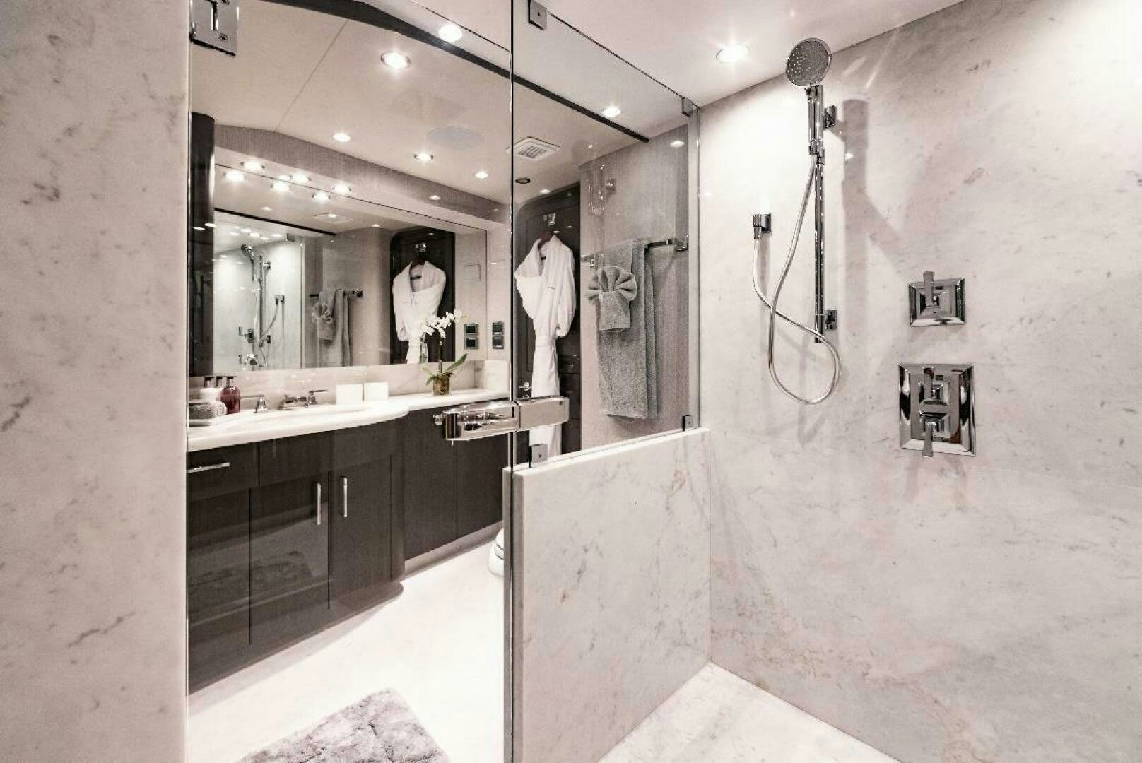 a bathroom with a mirror aboard MEMENTO VIVERE Yacht for Sale