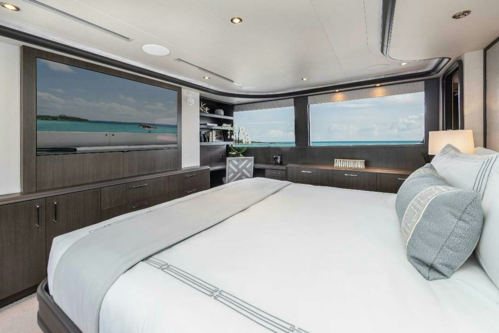a room with a bed and a tv aboard MEMENTO VIVERE Yacht for Sale