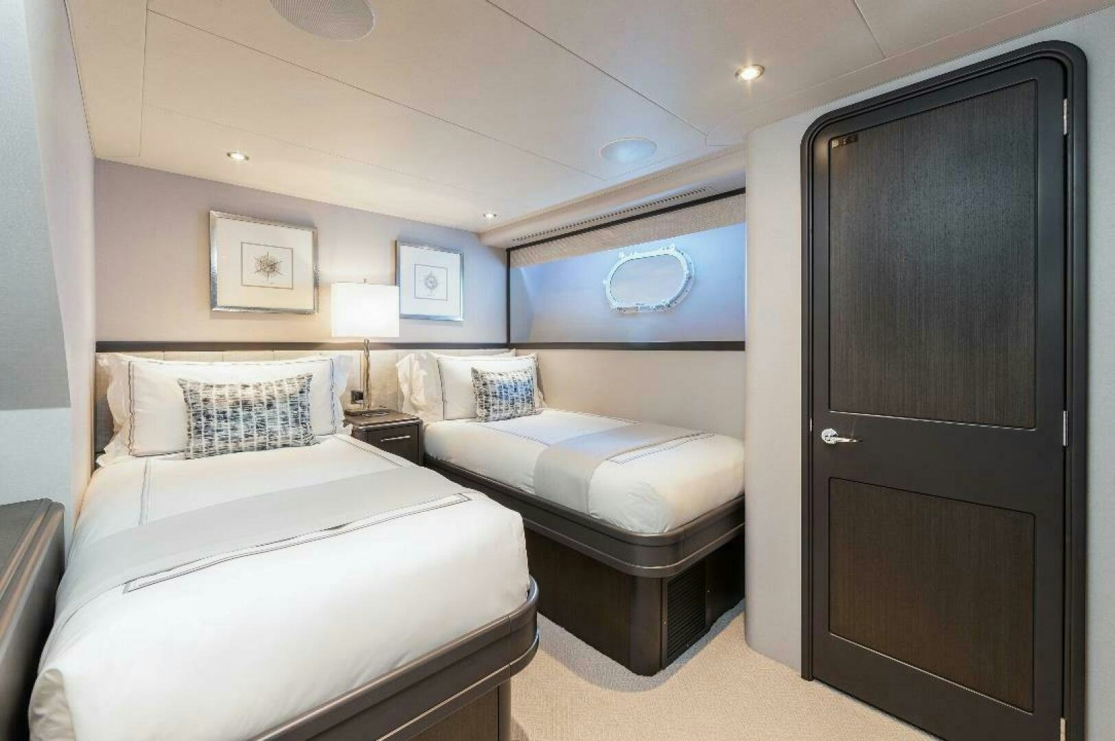 a room with two beds aboard MEMENTO VIVERE Yacht for Sale