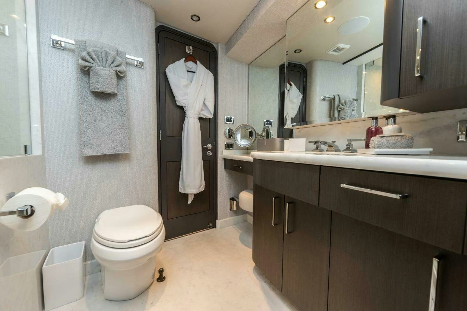 a bathroom with a toilet and a sink aboard MEMENTO VIVERE Yacht for Sale