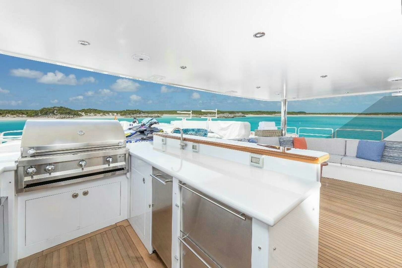 a large white kitchen with a pool aboard MEMENTO VIVERE Yacht for Sale