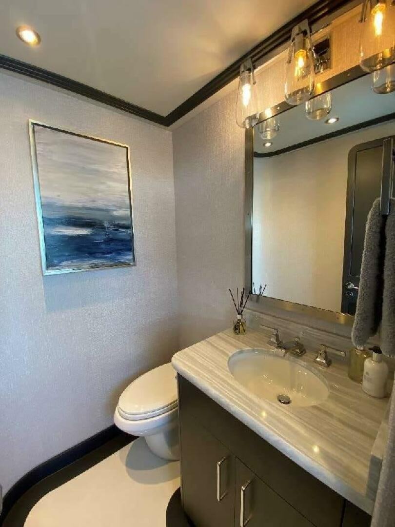 a bathroom with a sink and a toilet aboard MEMENTO VIVERE Yacht for Sale