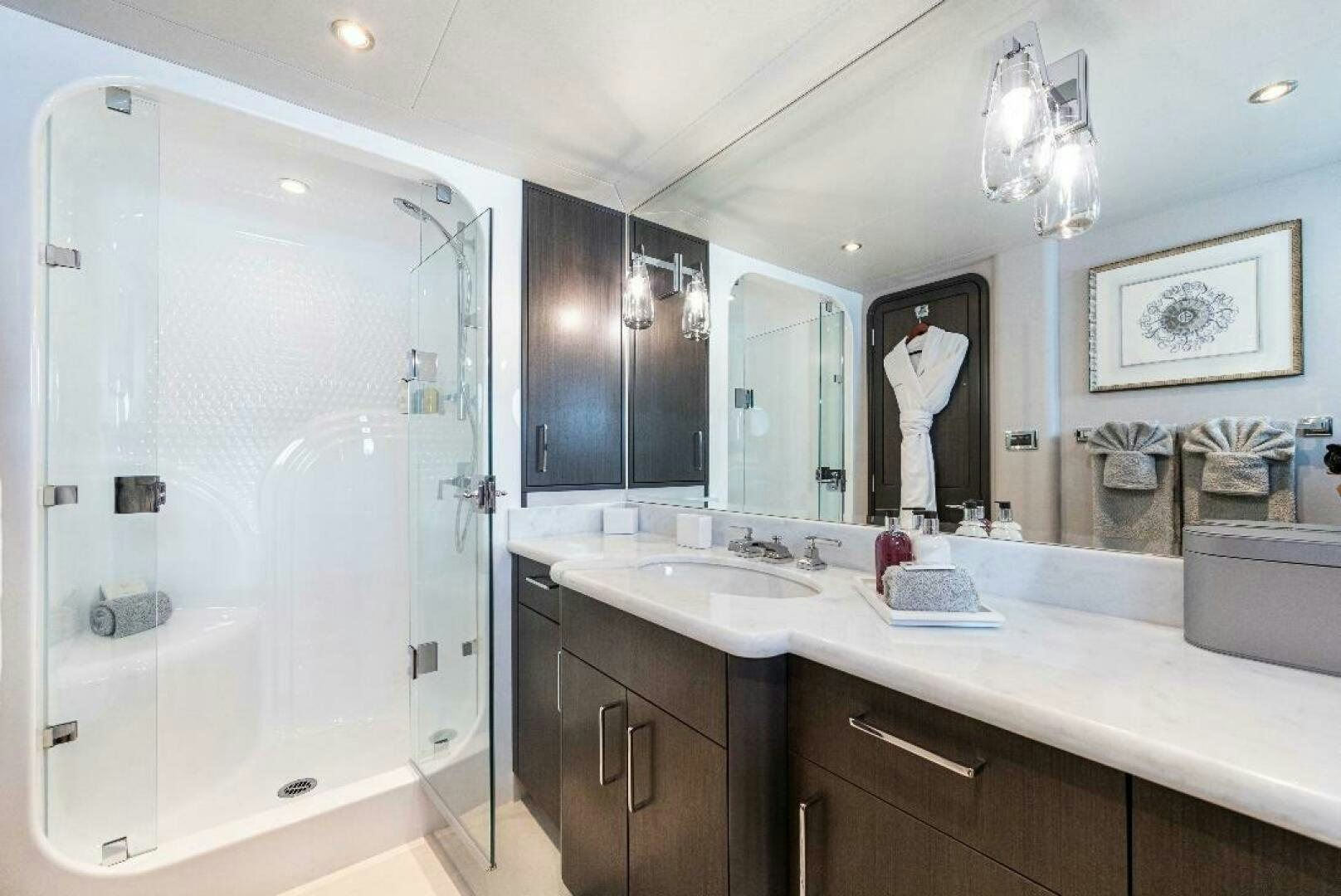 a bathroom with a large shower aboard MEMENTO VIVERE Yacht for Sale