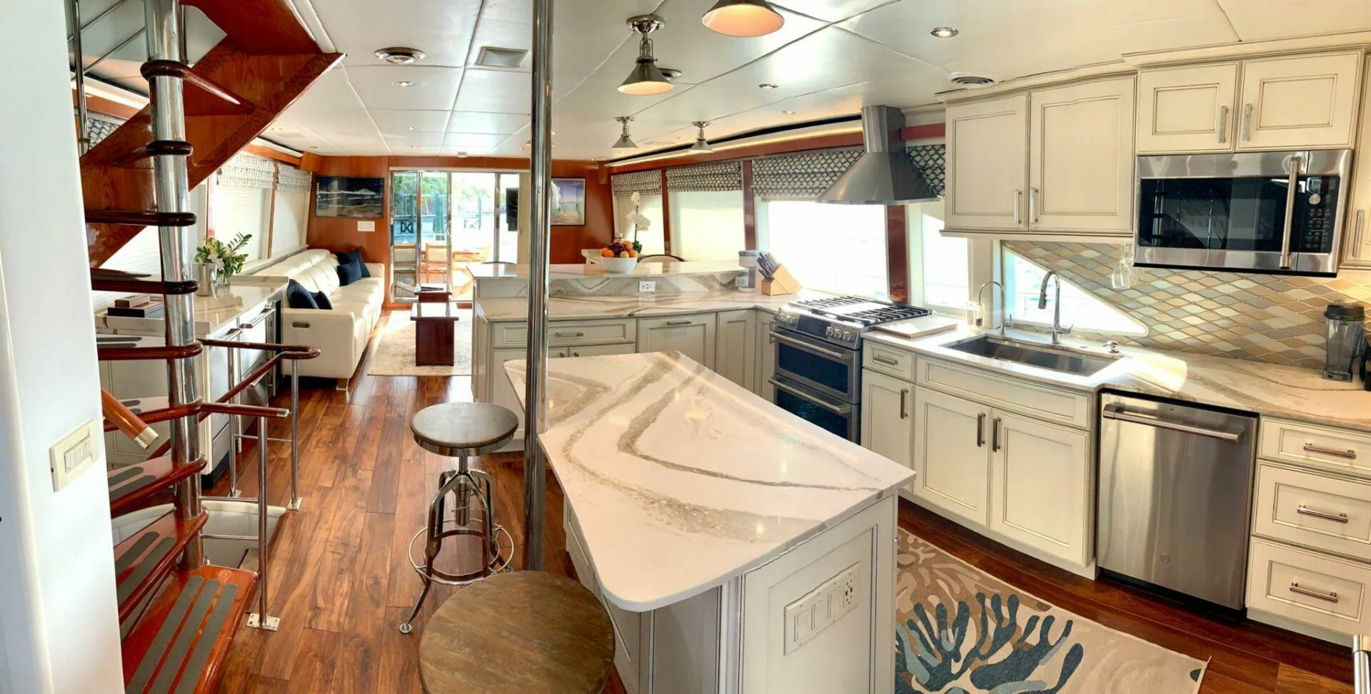 a kitchen with a ladder and a sink aboard CHASER - BEING OFFERED ON A 50% PARTNERSHIP BASIS Yacht for Sale