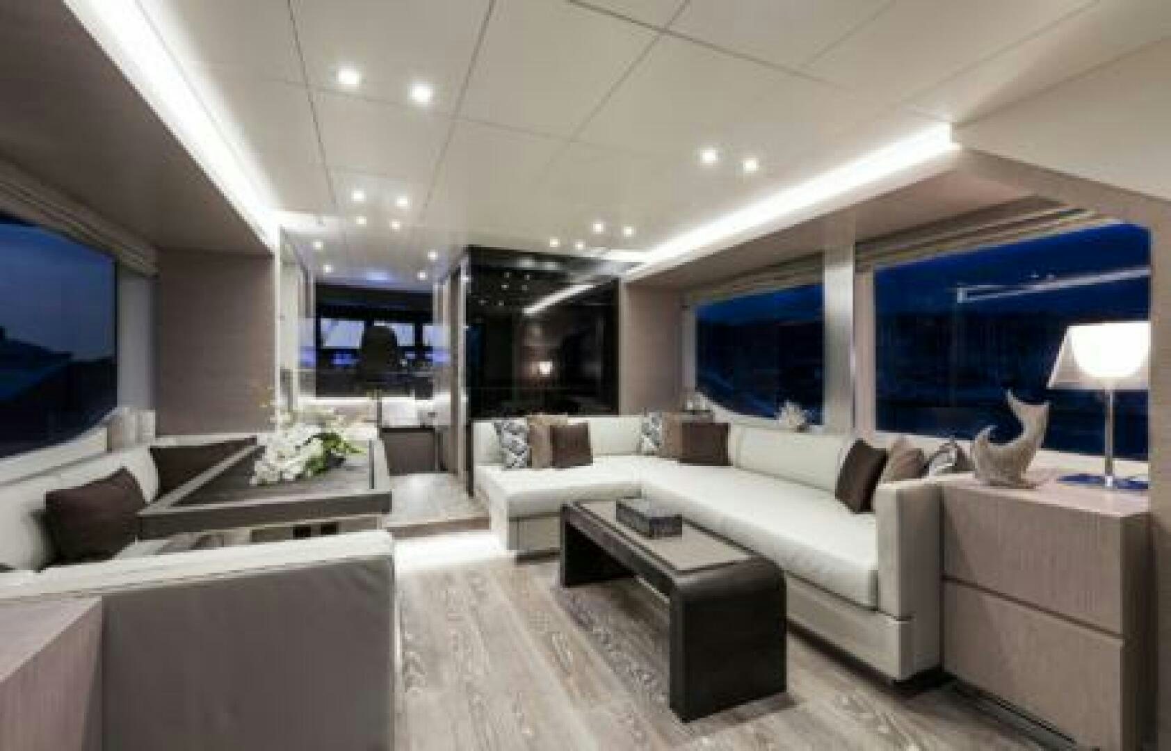 a living room with a large window aboard OCEANIC 76' GT Yacht for Sale