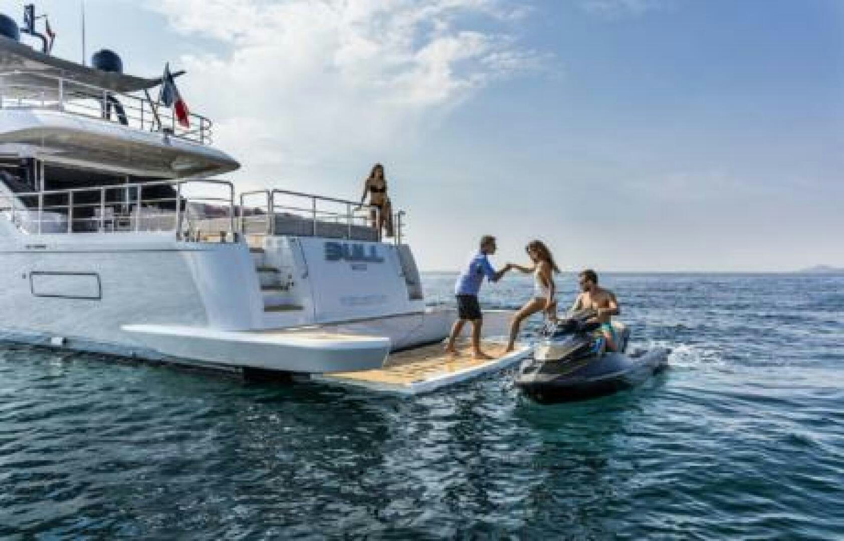a group of people on a boat aboard OCEANIC 76' GT Yacht for Sale