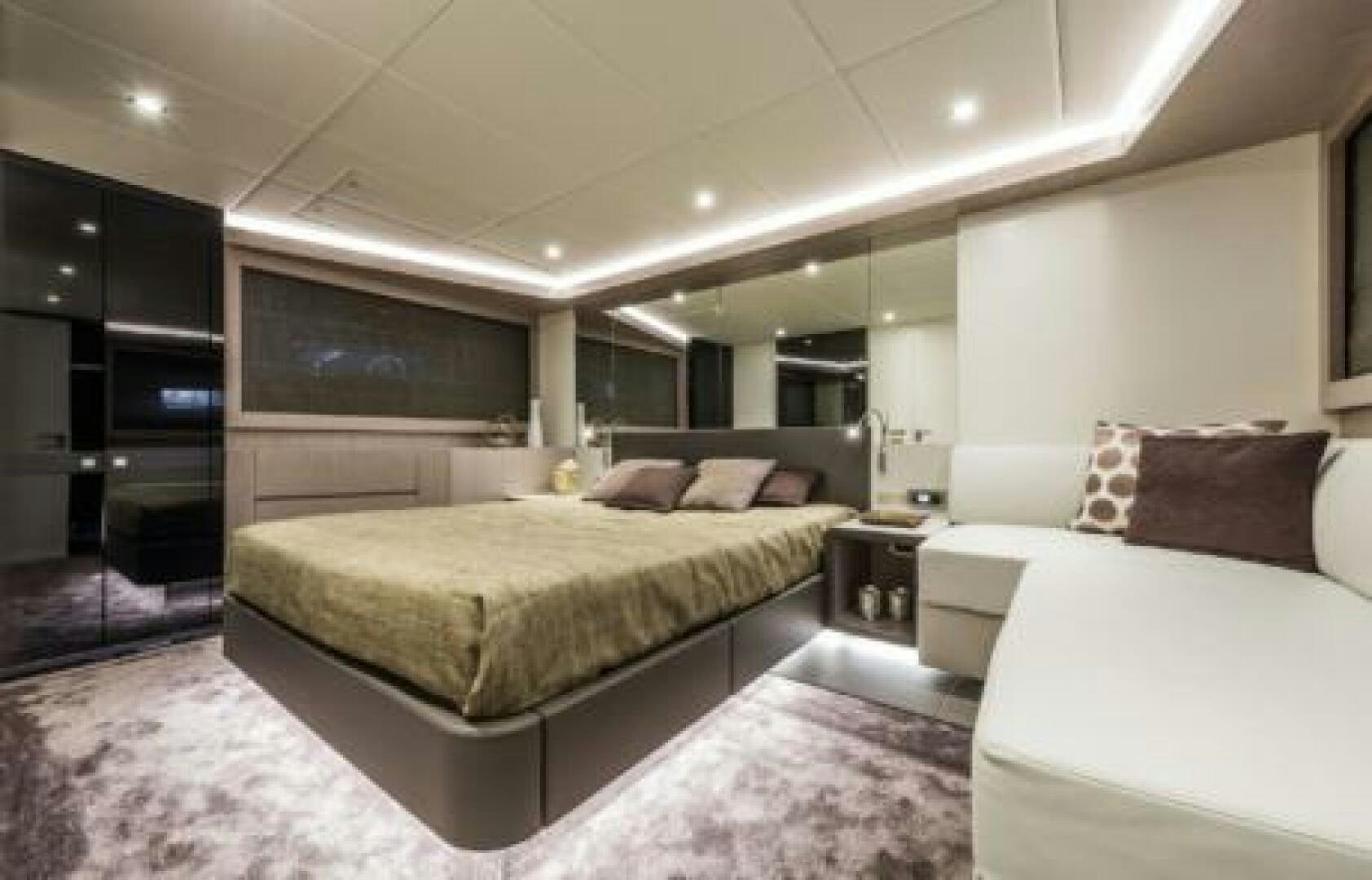 a room with two beds aboard OCEANIC 76' GT Yacht for Sale