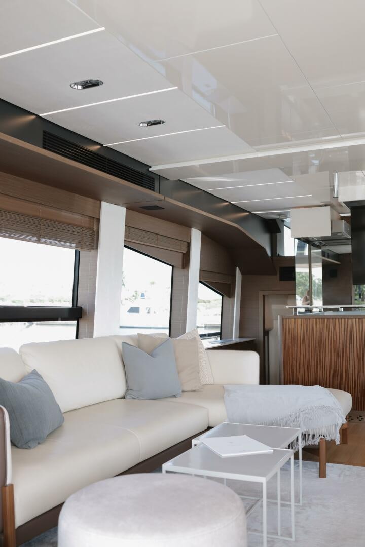 a living room with a couch and a table aboard IL DISFRUTE Yacht for Sale