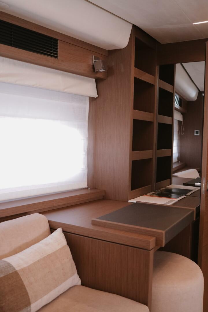 a room with a shelf and a window aboard IL DISFRUTE Yacht for Sale