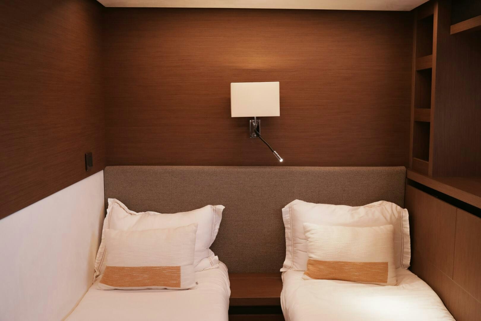 a bed with a lamp on it aboard IL DISFRUTE Yacht for Sale