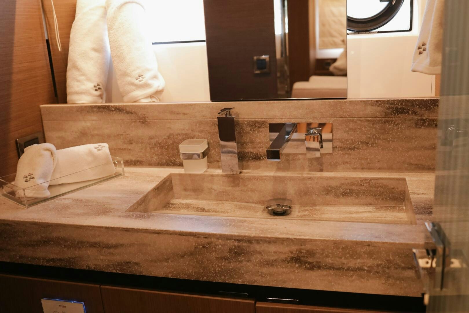 a bathroom counter with a towel and a towel aboard IL DISFRUTE Yacht for Sale