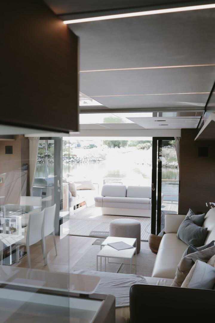 a living room with a large window aboard IL DISFRUTE Yacht for Sale