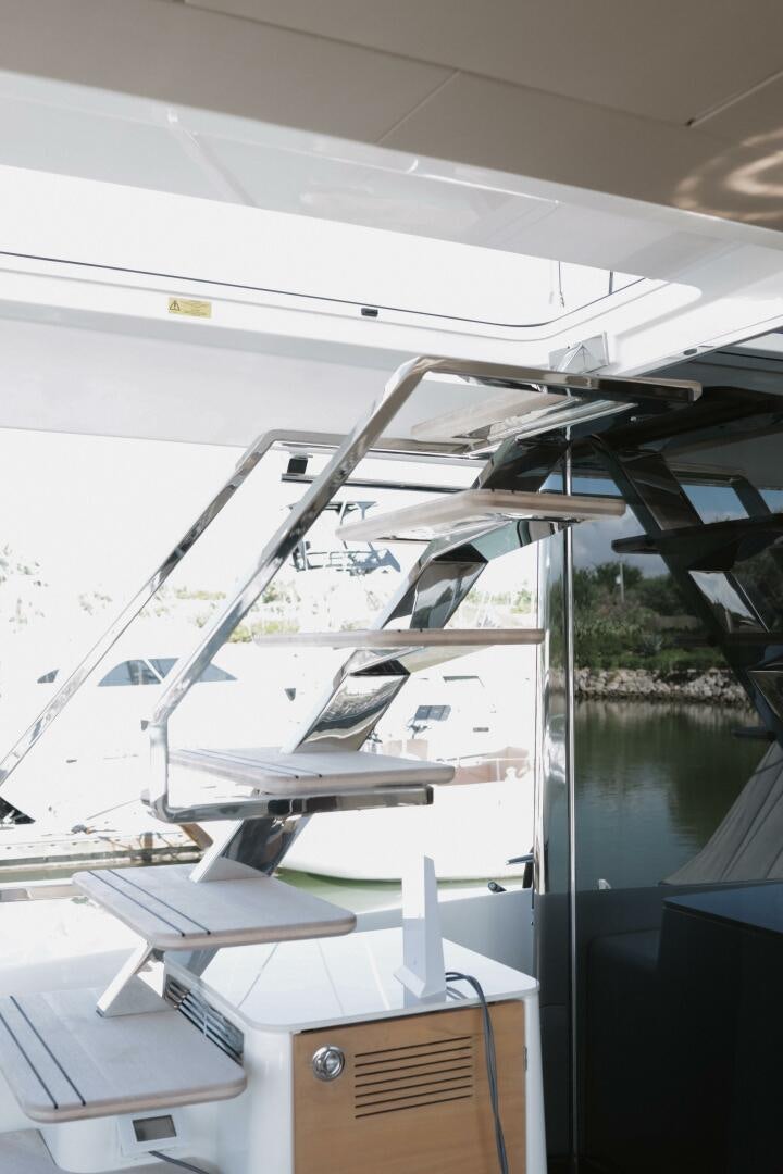 a white boat with a deck aboard IL DISFRUTE Yacht for Sale
