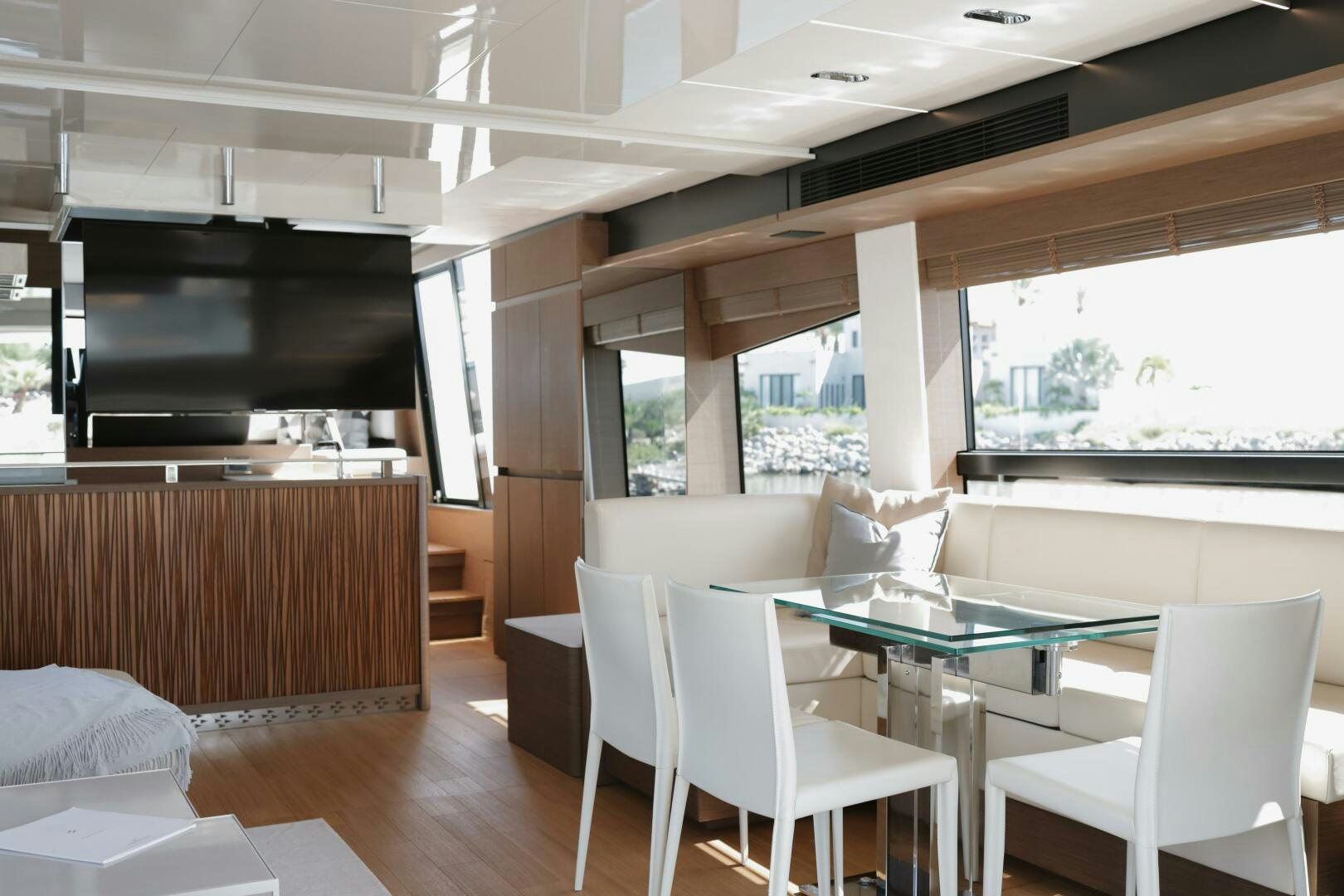 a room with a table and chairs aboard IL DISFRUTE Yacht for Sale