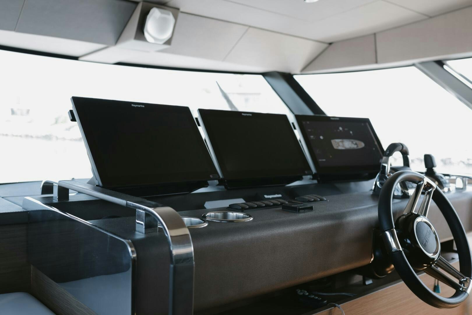 a black computer on a table aboard IL DISFRUTE Yacht for Sale