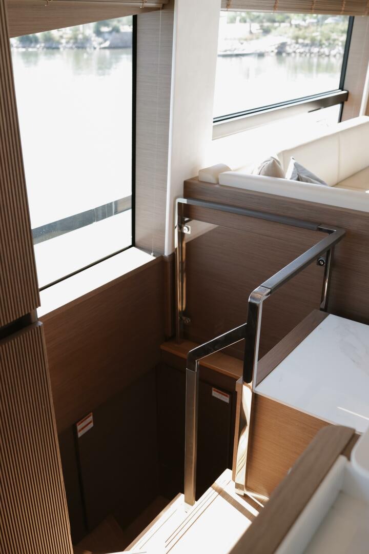 a bed and a window aboard IL DISFRUTE Yacht for Sale