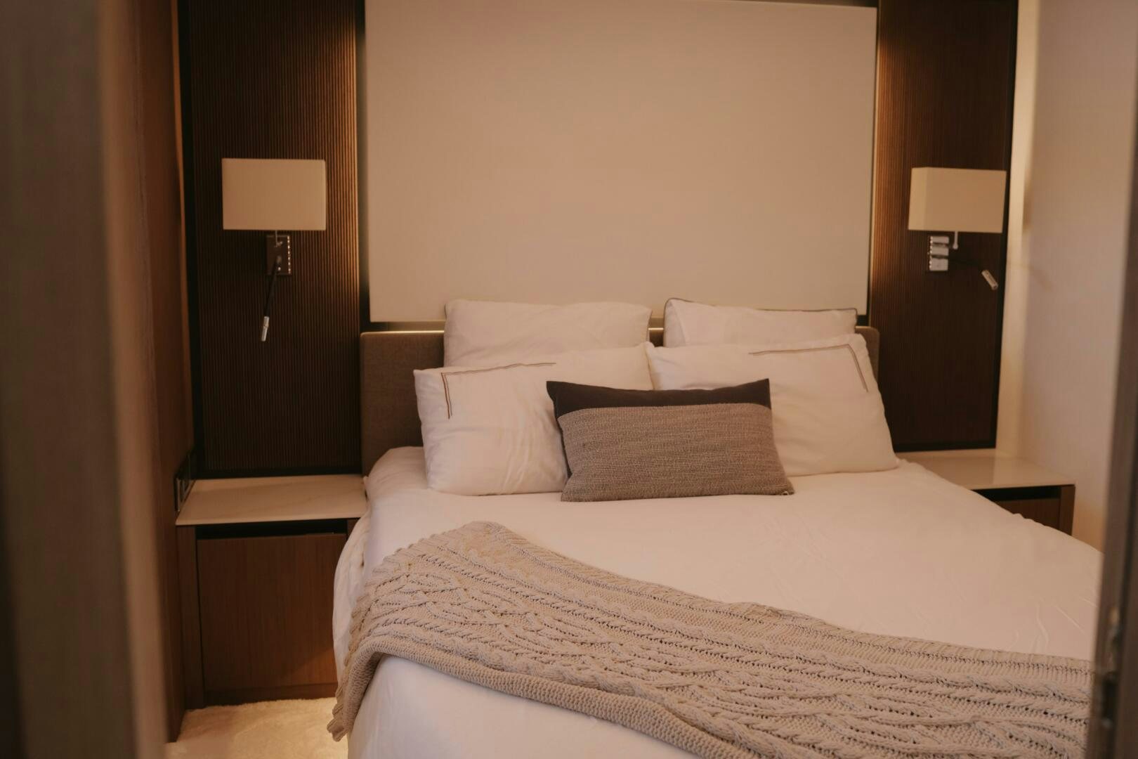 a bed with white sheets aboard IL DISFRUTE Yacht for Sale