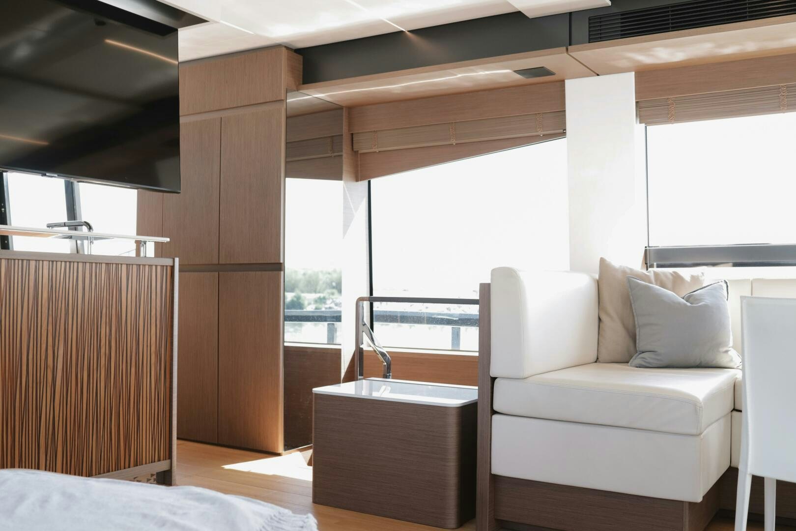 a room with a couch and a table aboard IL DISFRUTE Yacht for Sale