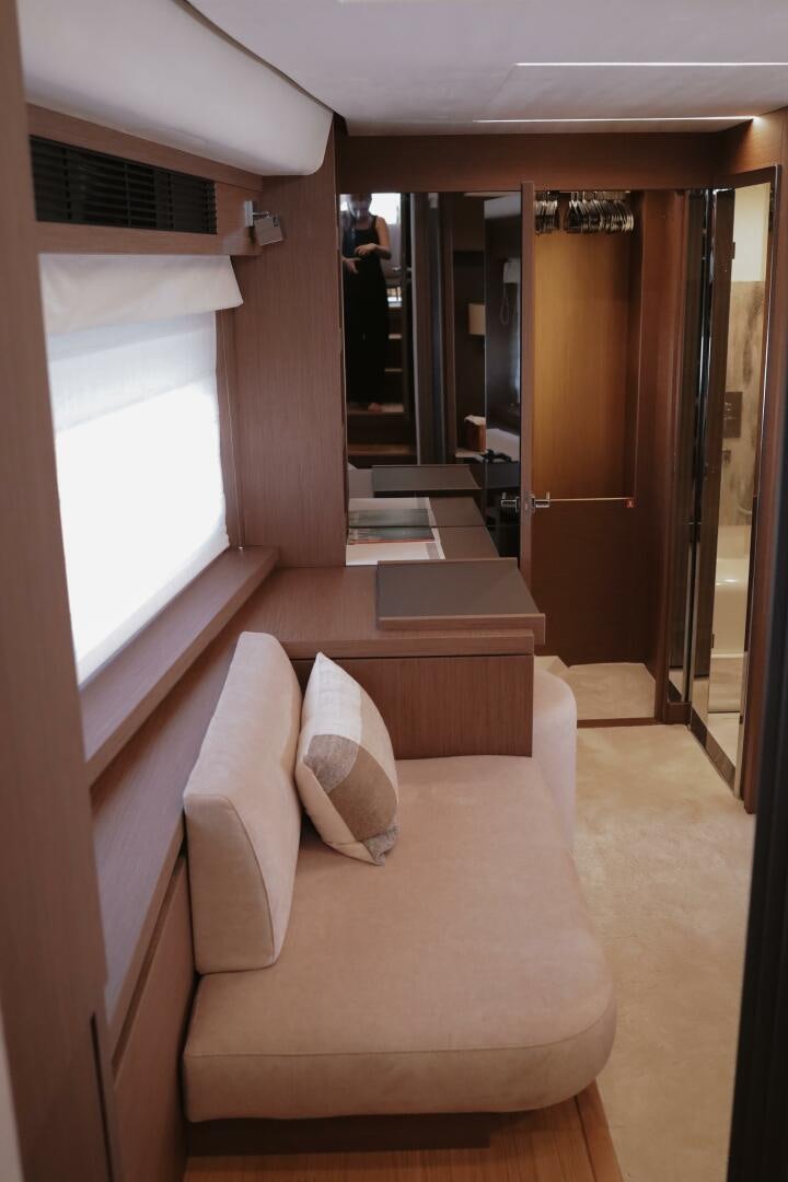 a room with a couch and a door aboard IL DISFRUTE Yacht for Sale