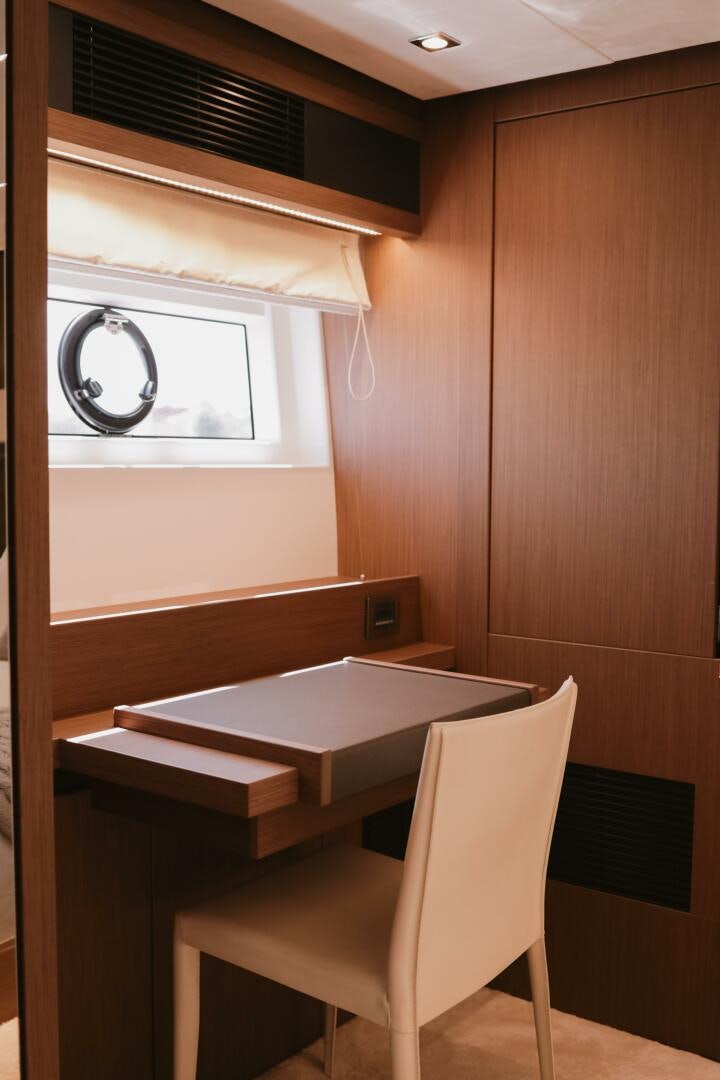 a room with a table and chairs aboard IL DISFRUTE Yacht for Sale