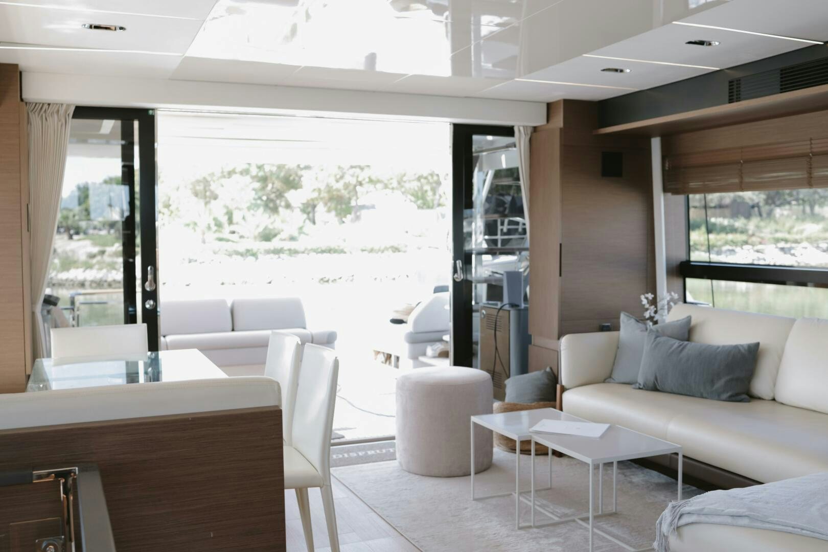 a room with a couch and a table and chairs aboard IL DISFRUTE Yacht for Sale