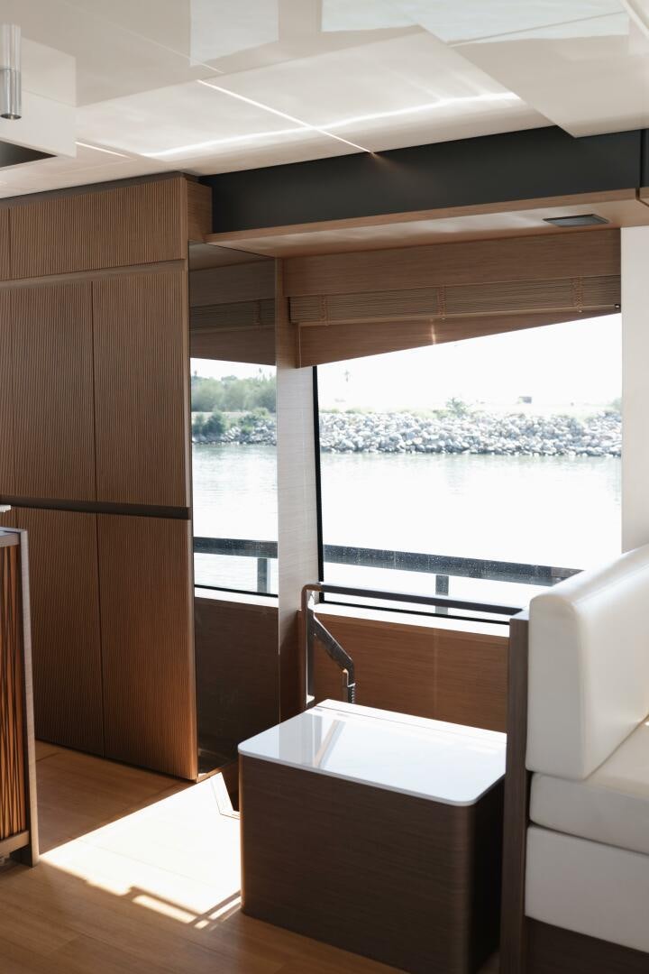 a room with a large window and a view of a city aboard IL DISFRUTE Yacht for Sale