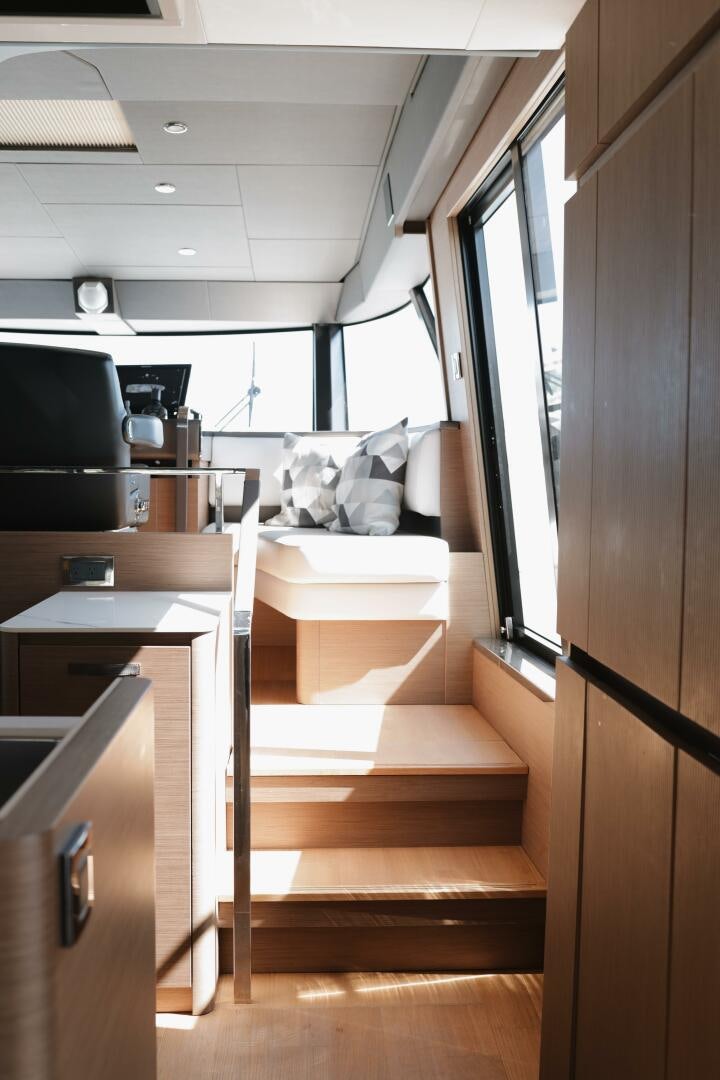 a room with a bed and a desk aboard IL DISFRUTE Yacht for Sale