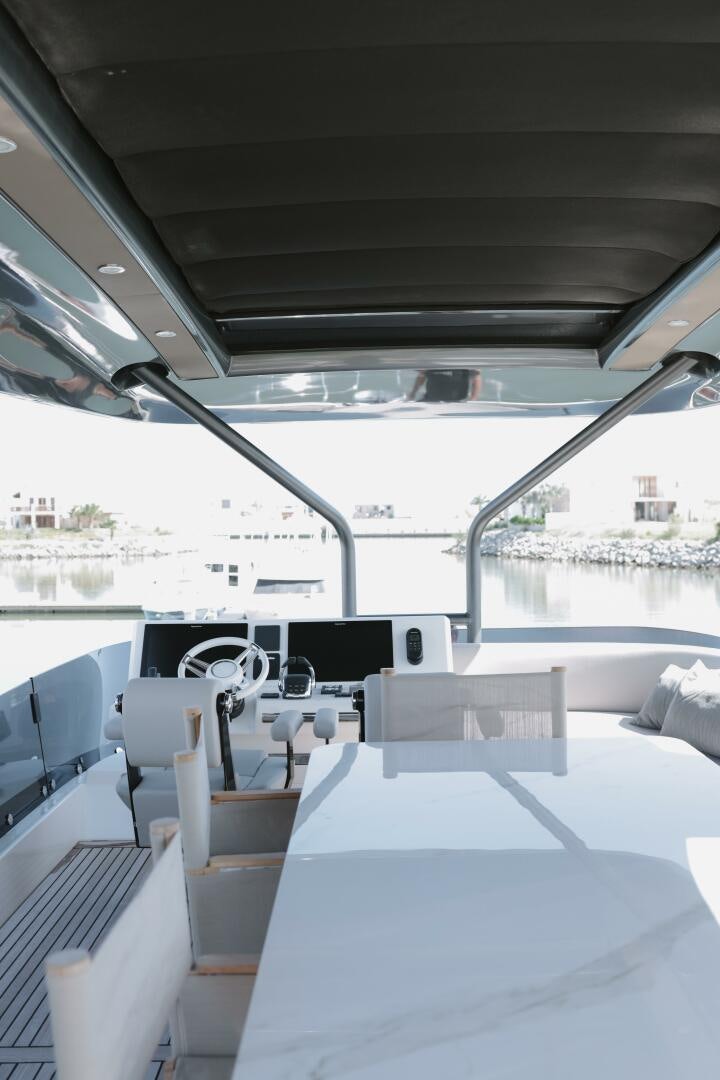 inside of a vehicle with a large window and a view of the city aboard IL DISFRUTE Yacht for Sale
