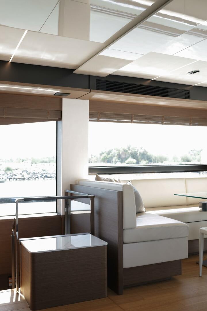 a room with a couch and a table aboard IL DISFRUTE Yacht for Sale