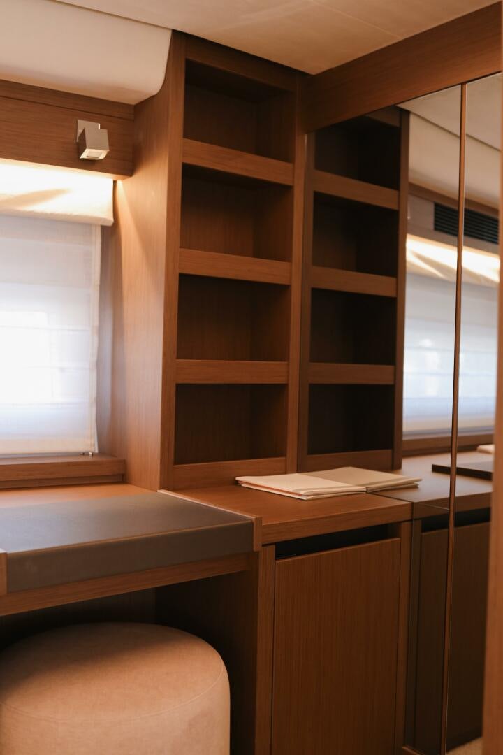 a room with a shelf and a bookcase aboard IL DISFRUTE Yacht for Sale