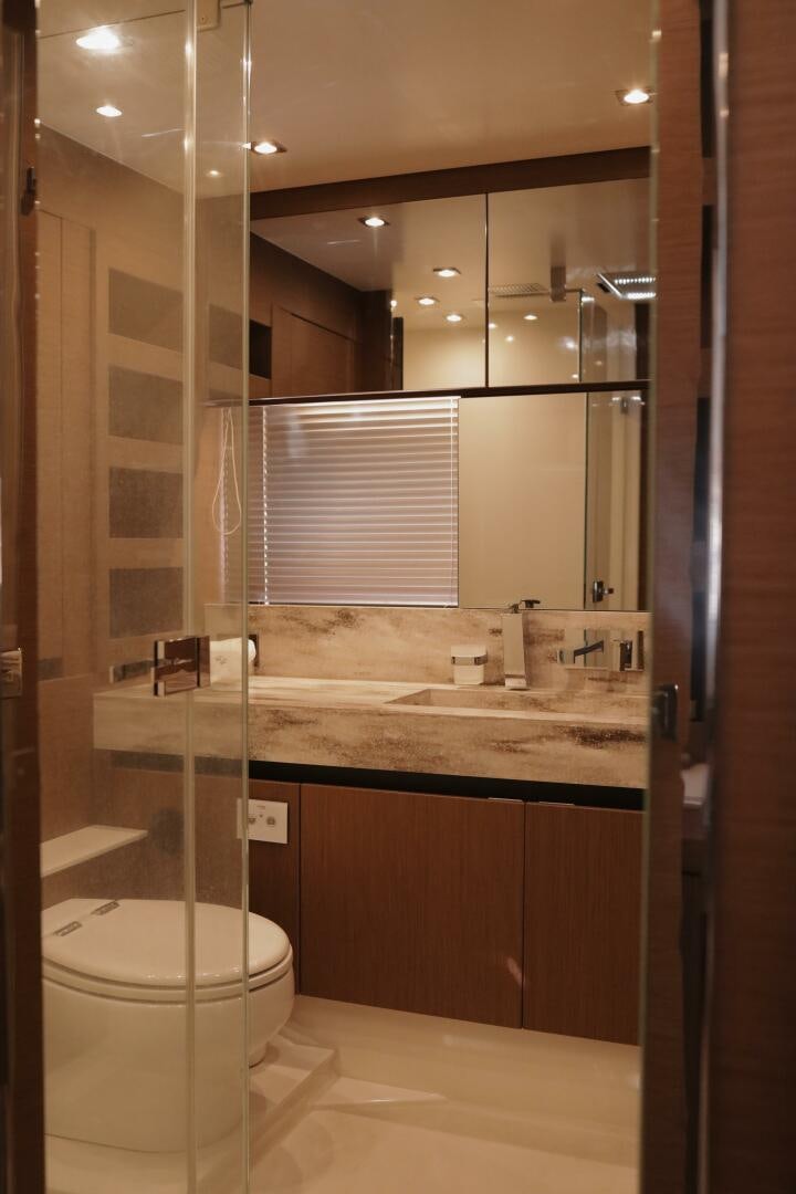 a bathroom with a large mirror aboard IL DISFRUTE Yacht for Sale