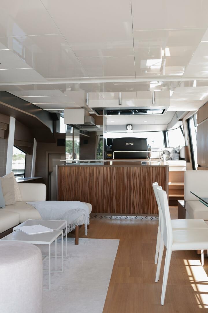 a room with a couch and a table and chairs aboard IL DISFRUTE Yacht for Sale