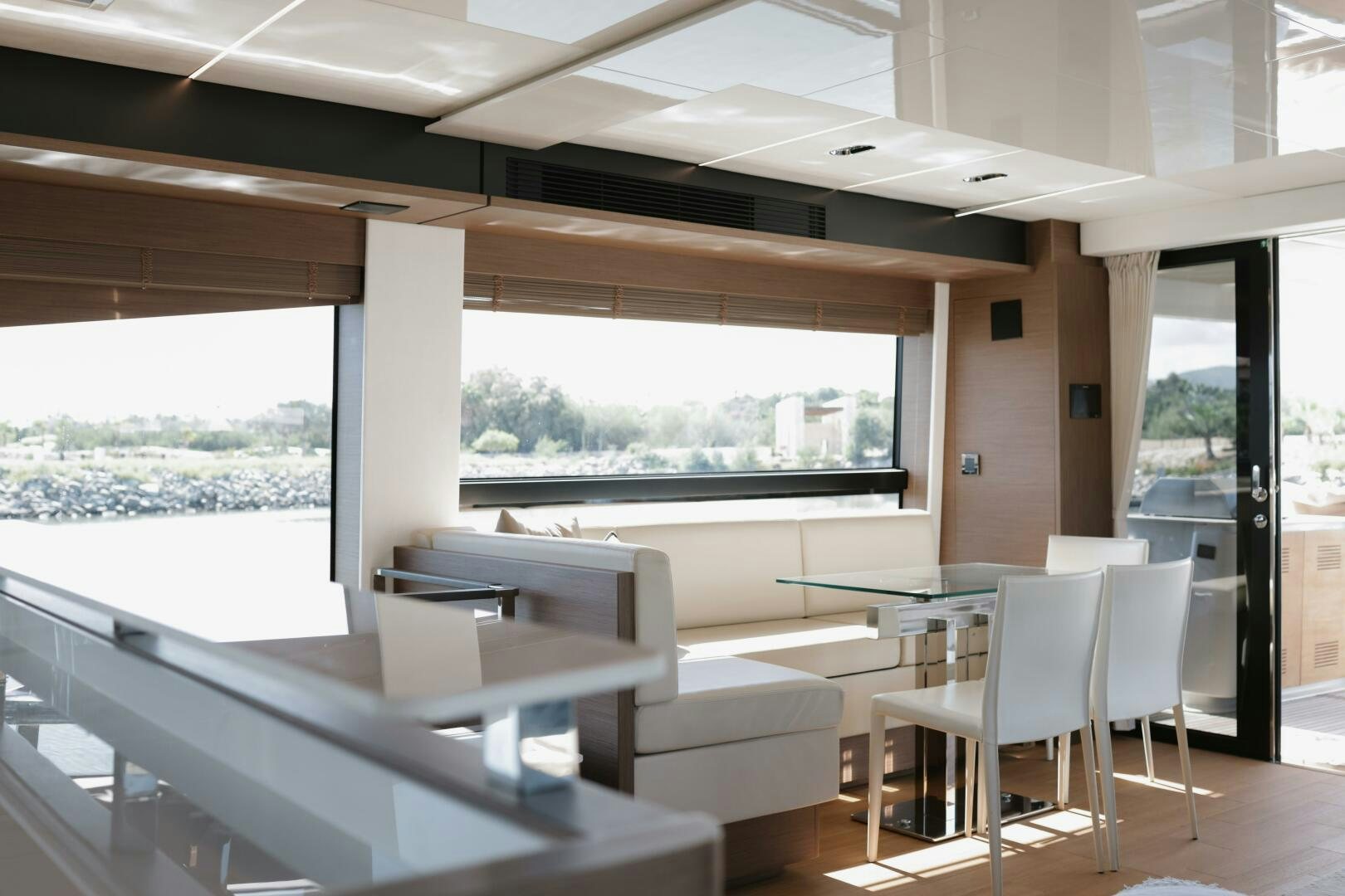 a room with tables and chairs aboard IL DISFRUTE Yacht for Sale