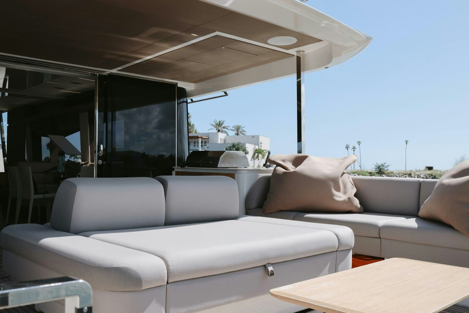 a white couch in a car aboard IL DISFRUTE Yacht for Sale