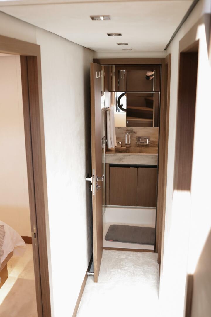 a bathroom with a sink and a mirror aboard IL DISFRUTE Yacht for Sale