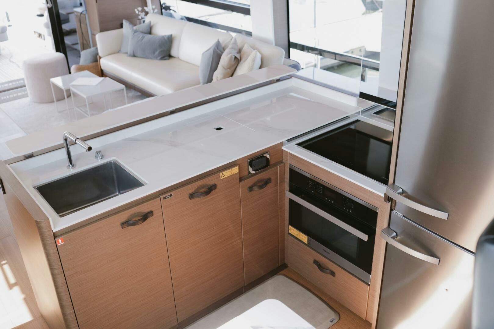 a kitchen with a sink and a refrigerator aboard IL DISFRUTE Yacht for Sale