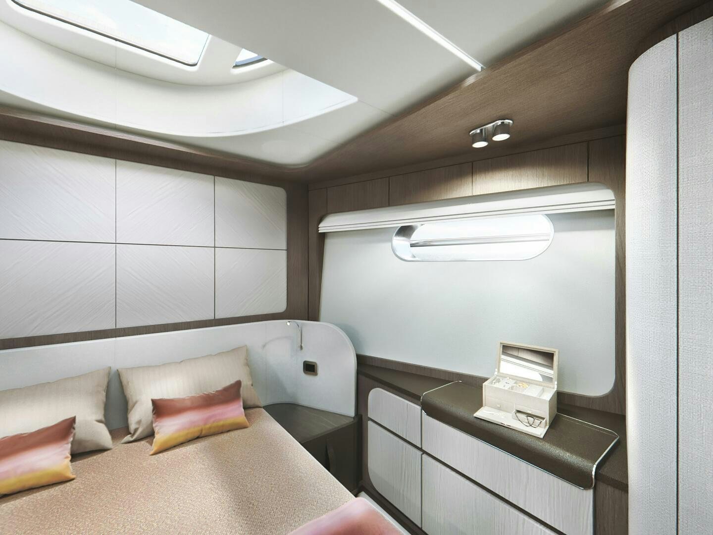 a room with a bed and desk aboard CORMORANT Yacht for Sale