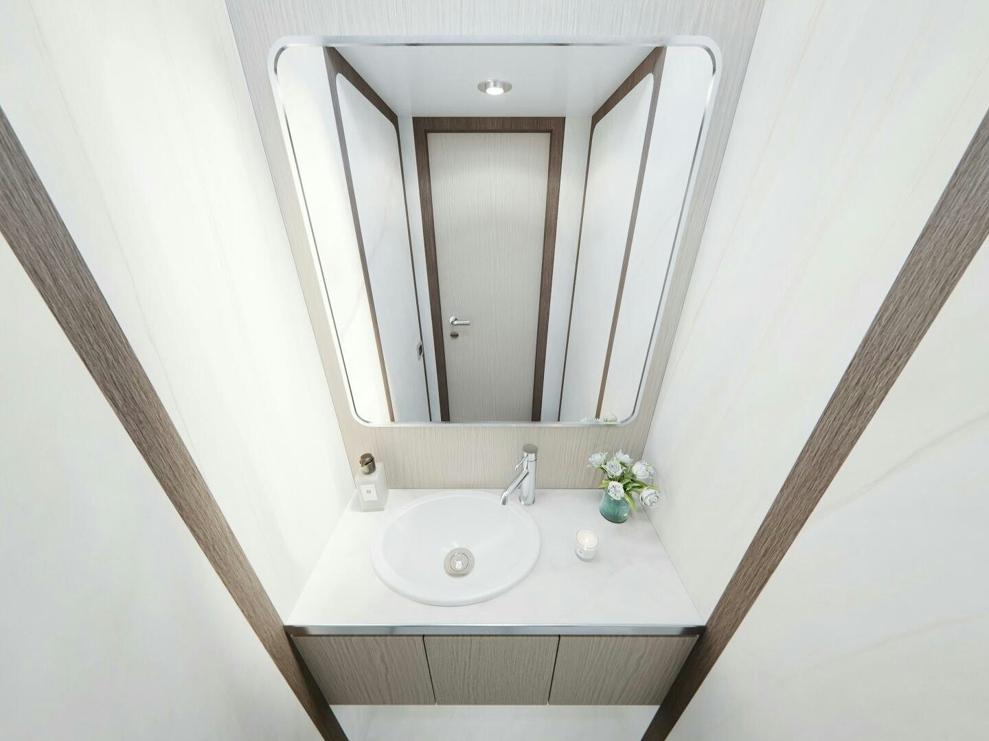 a bathroom with a mirror aboard CORMORANT Yacht for Sale