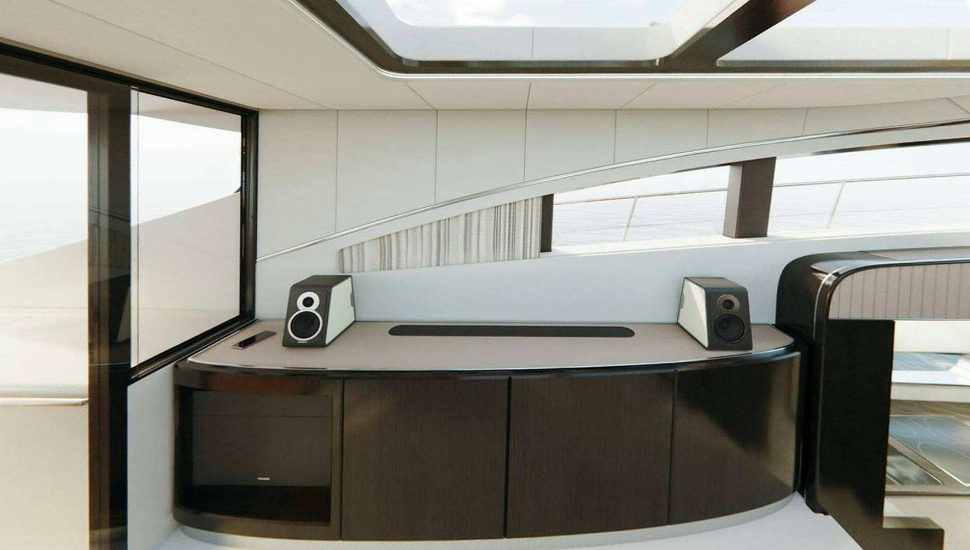 a desk with speakers on it aboard CORMORANT Yacht for Sale