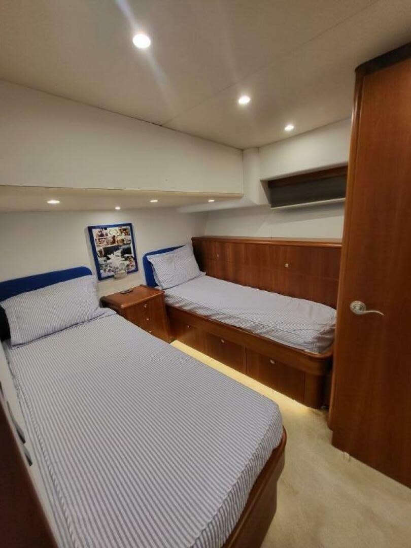 a couple of beds in a room aboard MAR JON Yacht for Sale