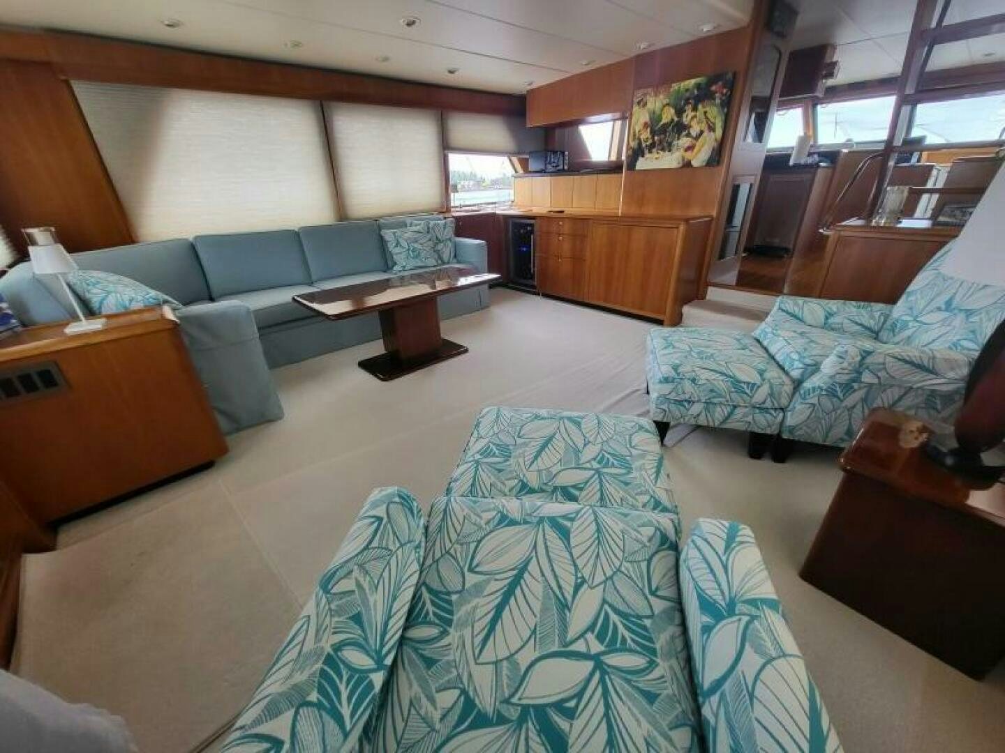 a room with couches and a table aboard MAR JON Yacht for Sale
