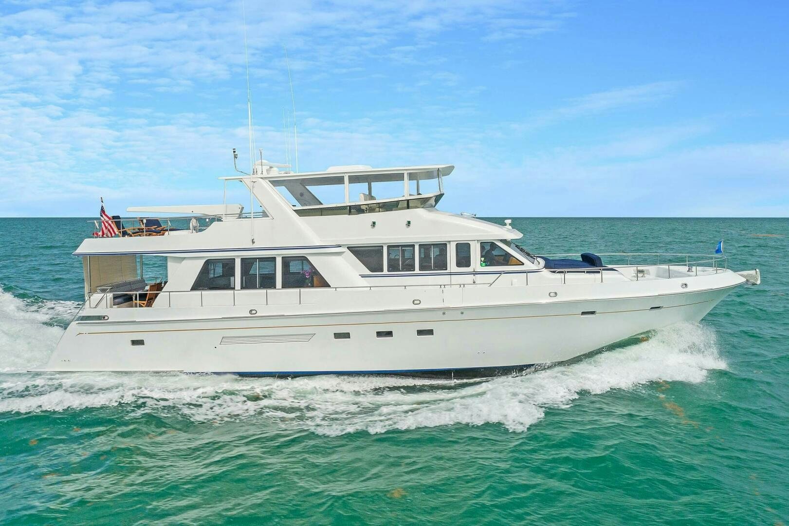 a white boat on the water aboard MAR JON Yacht for Sale