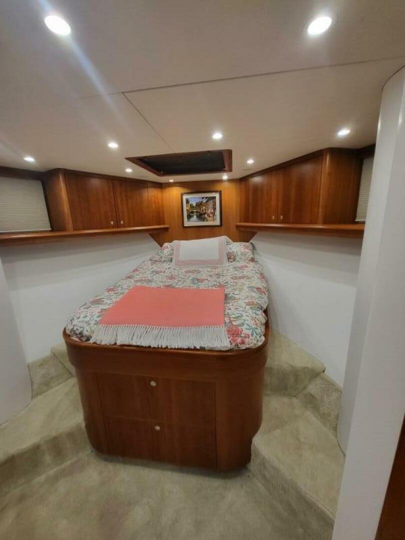a bed in a room aboard MAR JON Yacht for Sale