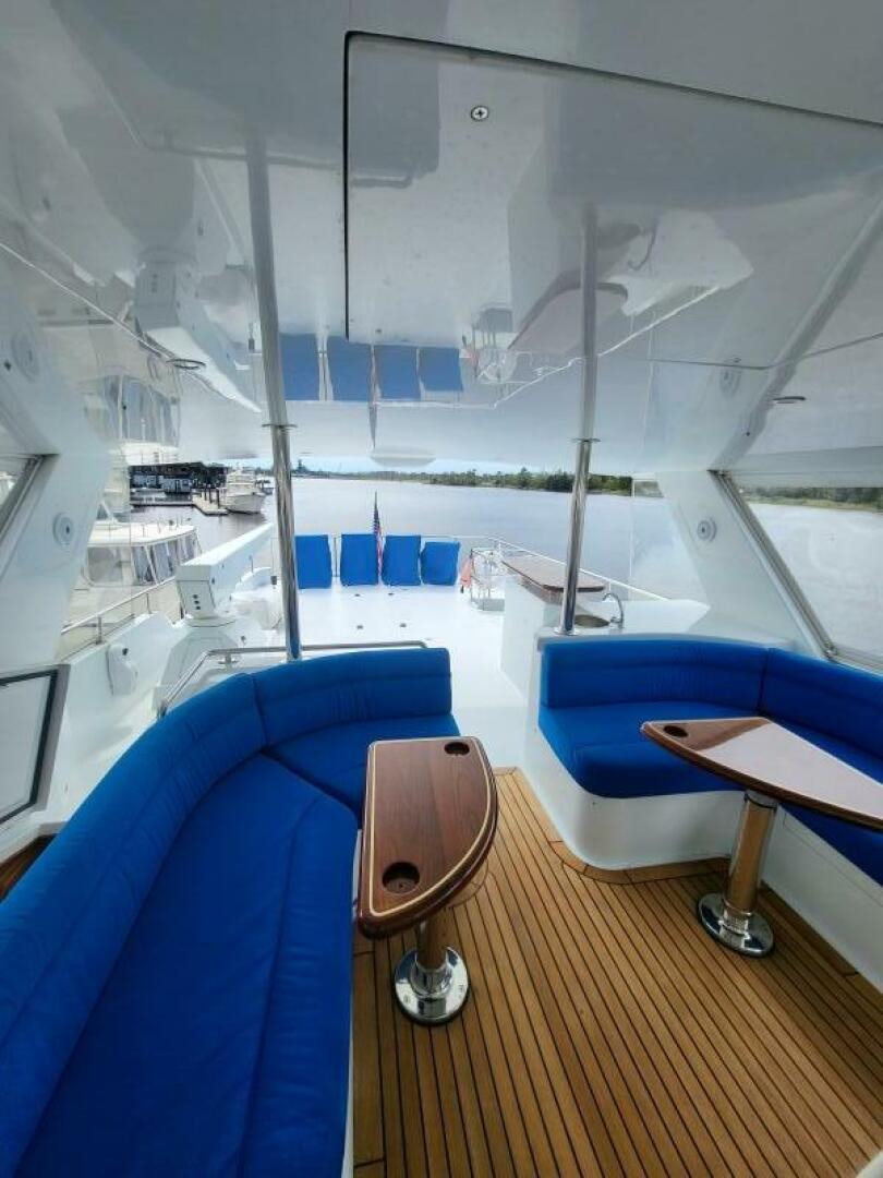 a room with a view of the water and a boat aboard MAR JON Yacht for Sale
