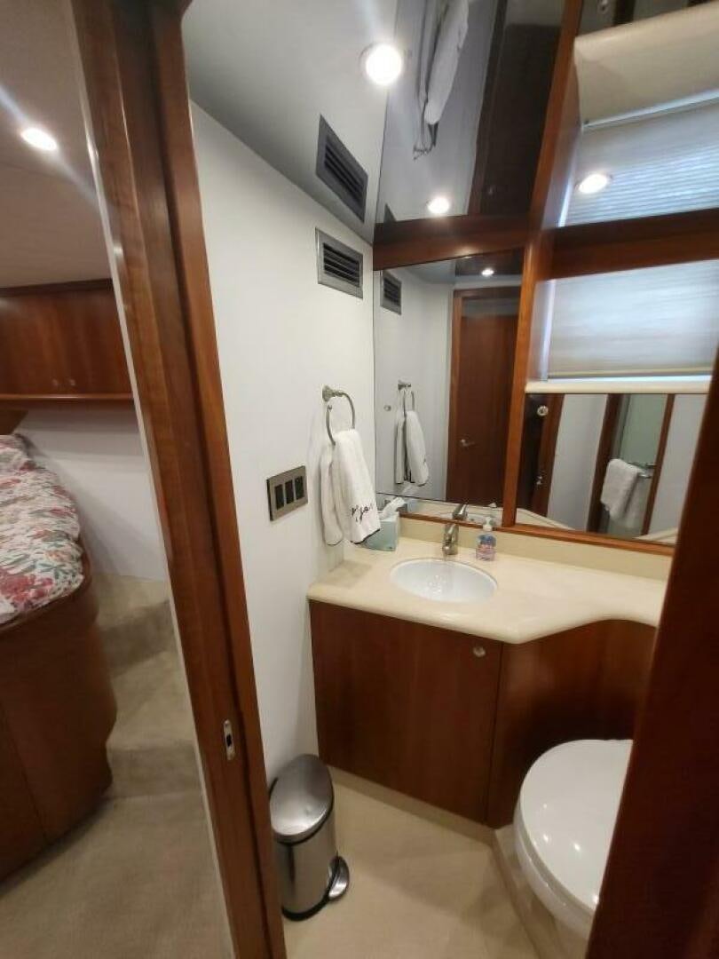 a bathroom with a sink and a toilet aboard MAR JON Yacht for Sale