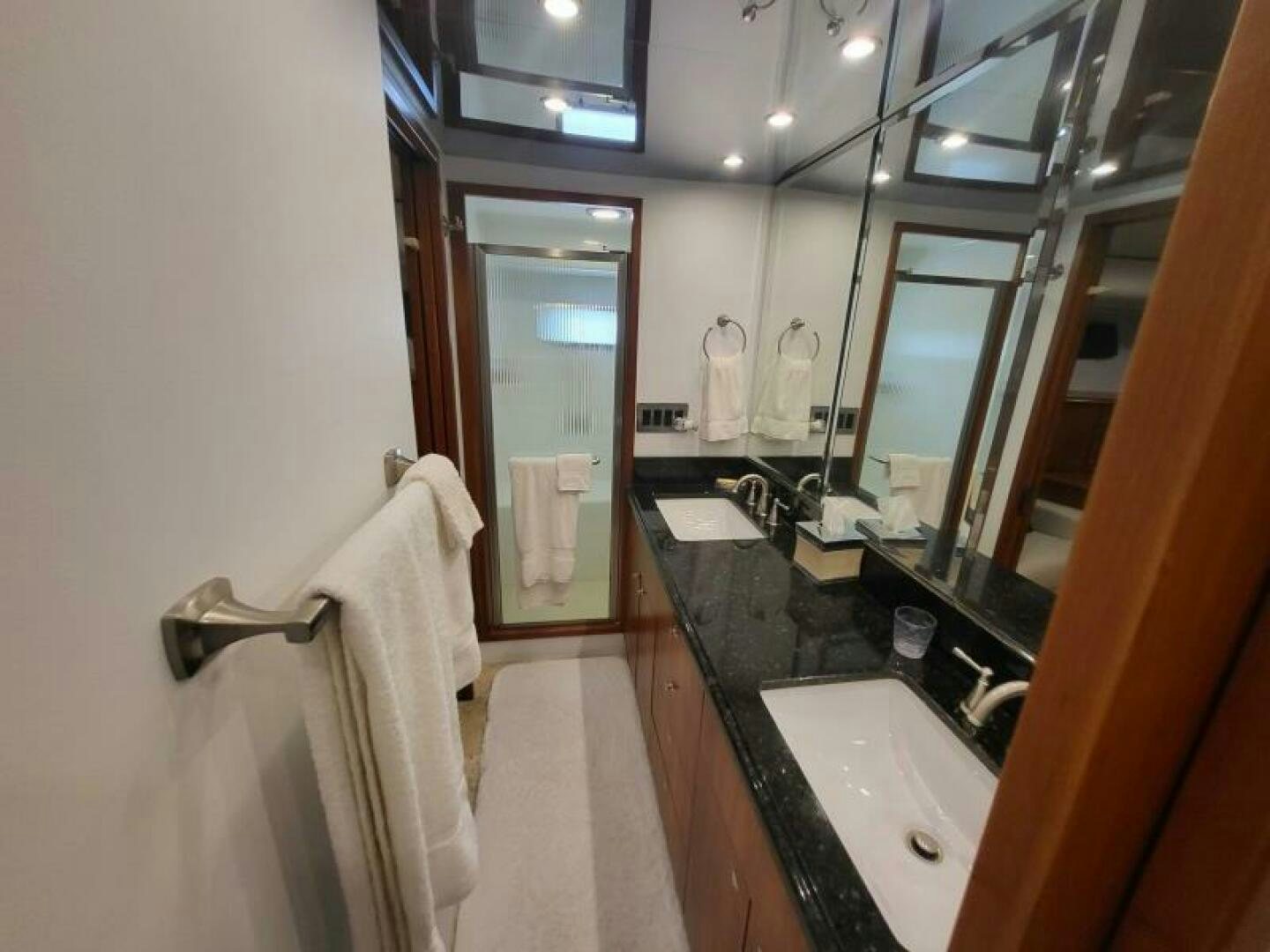 a bathroom with a sink and a mirror aboard MAR JON Yacht for Sale