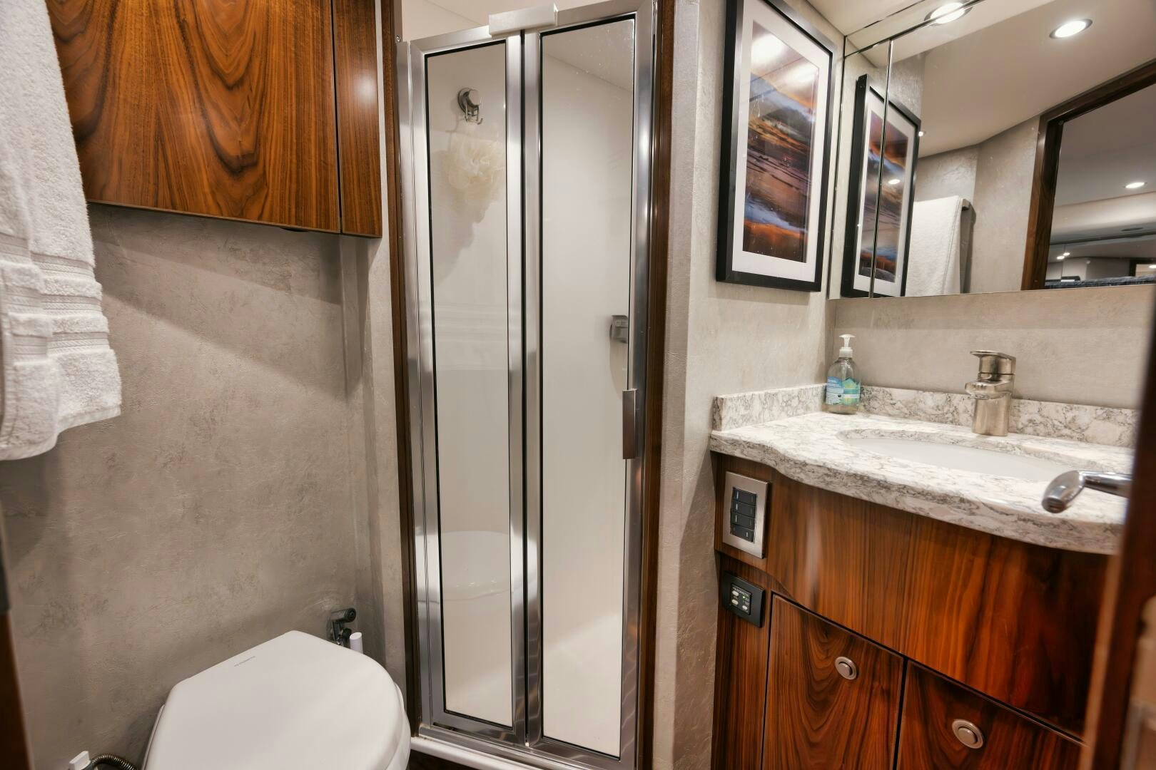 a bathroom with a glass shower aboard DOUBLE SHOT Yacht for Sale