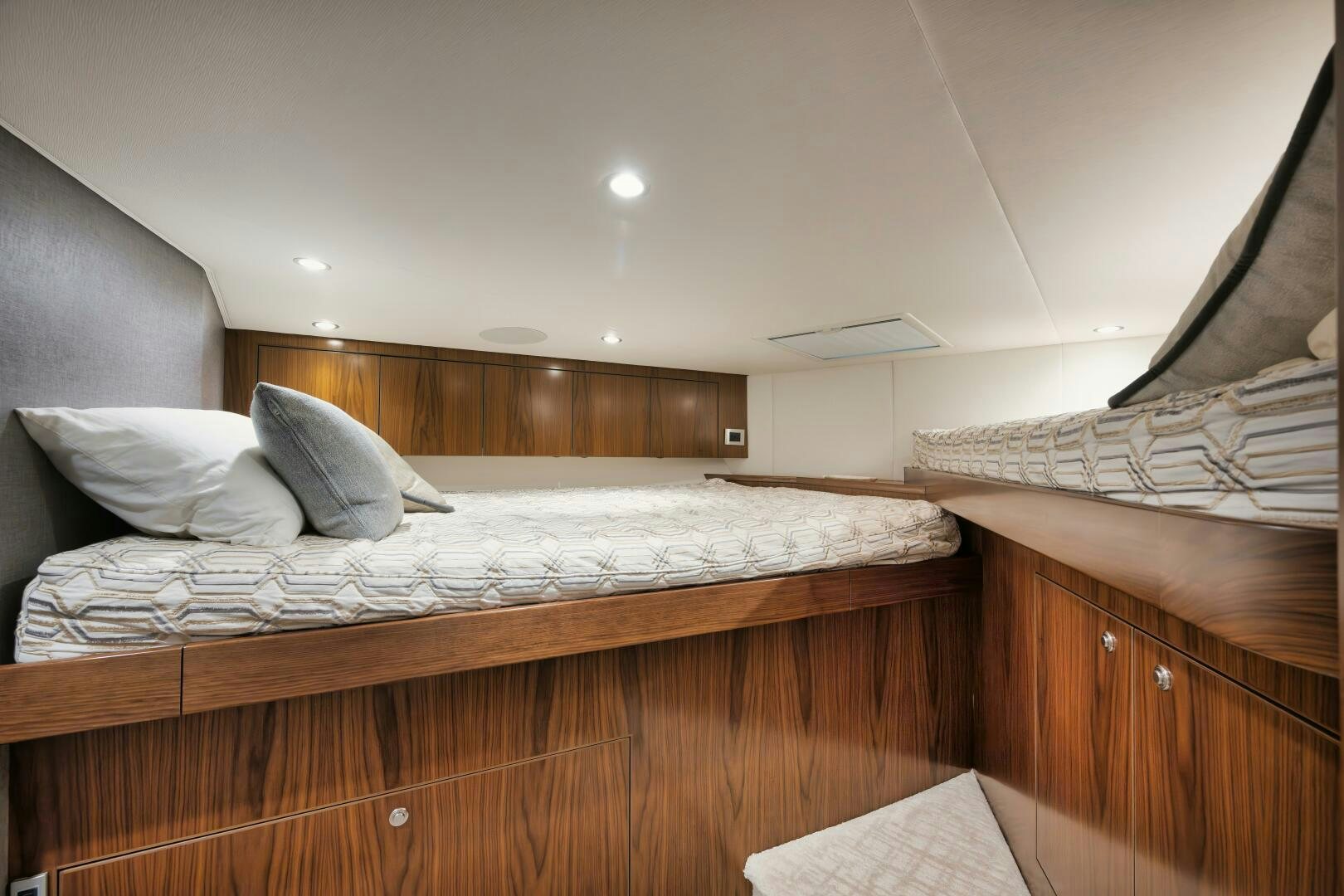 a room with a bed and a wood wall aboard DOUBLE SHOT Yacht for Sale