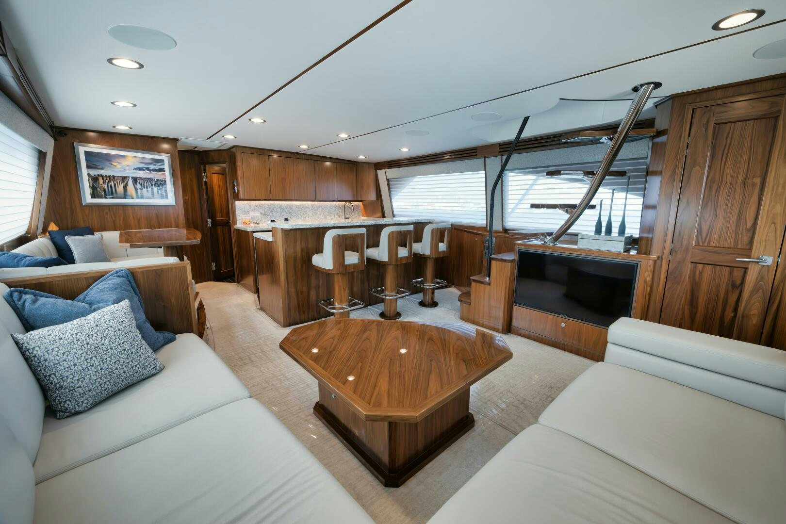a living room with a wood table aboard DOUBLE SHOT Yacht for Sale